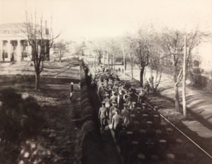Troops passing McCormick Hall.