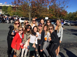 Delta Chis from the Class of 2014 get together at a tailgate over Homecoming weekend