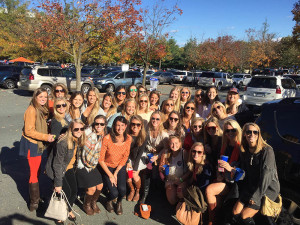 Recent Theta grads show their love for the Hoos at the Homecoming game against Syracusre on Saturday, October 17.