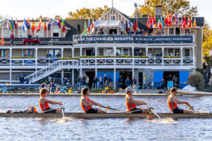 Side view of a boat of four competing at the Head of the Charles Regatta